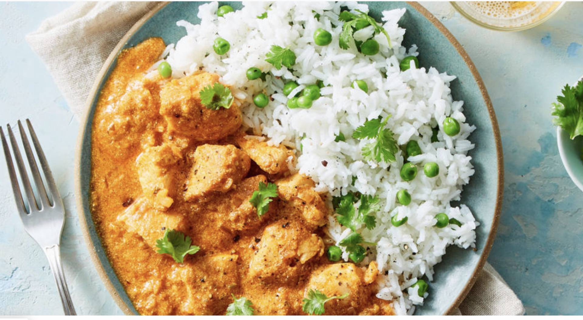 Chicken Tikka Masala with Basmati Rice, Spiced Cauliflower, Green Peas, and Yogurt-Lime Drizzle